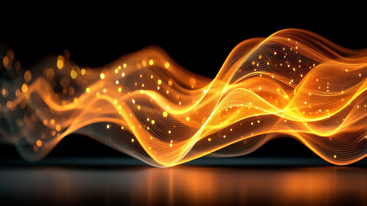 Abstract orange light waves with glowing particles flowing across a black background, symbolizing energy and motion.