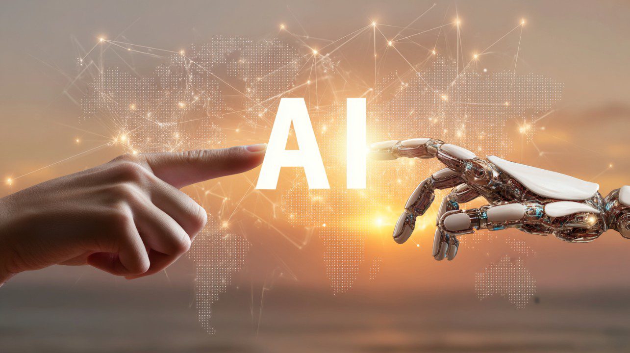 A human finger and a robotic hand reaching toward each other with “AI” glowing between them, symbolizing artificial intelligence collaboration.