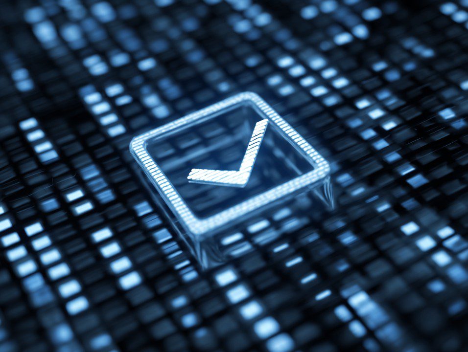 A futuristic blue checkbox icon glowing over a pixelated digital background, symbolizing system validation and tech UI elements.