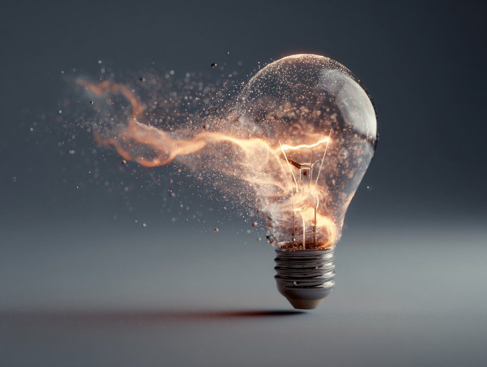 An abstract light bulb surrounded by sparks, symbolizing creativity, ideas, and innovation in design and business.