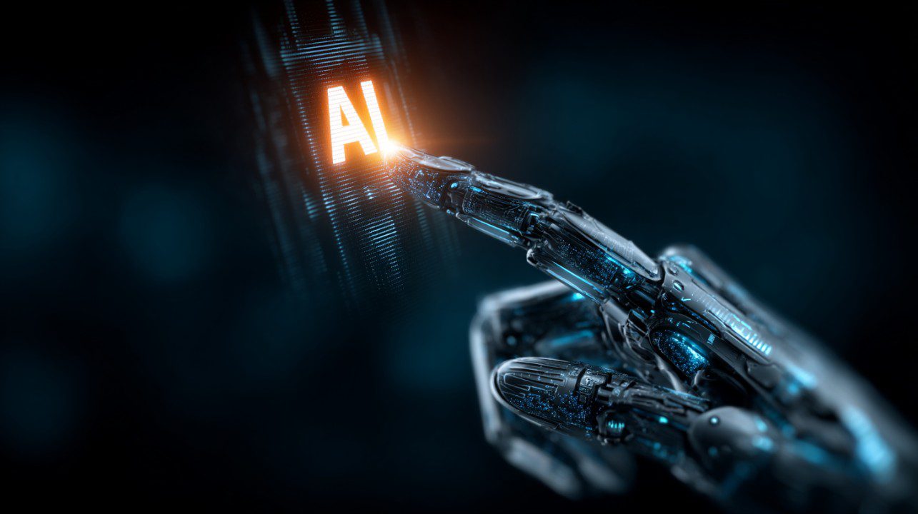Close-up of a robotic finger interacting with a glowing "AI" display, symbolizing futuristic artificial intelligence technology.