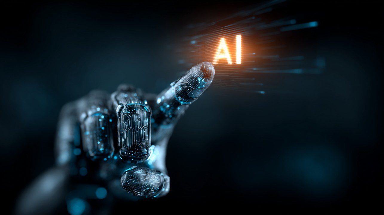 A futuristic robotic hand illuminated with circuit-like patterns reaches toward glowing orange AI text on a dark blue background.